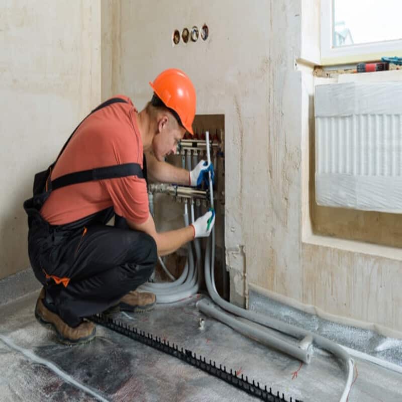 worker-installing-pipe-warm-floor-apartment_191163-1322 (1) (1)